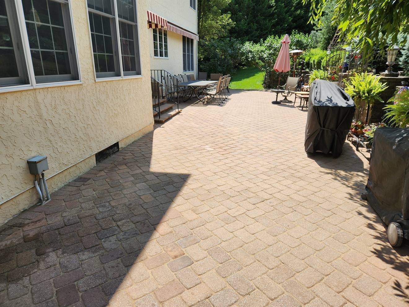 Paver surface connecting the side of the home to the front approach