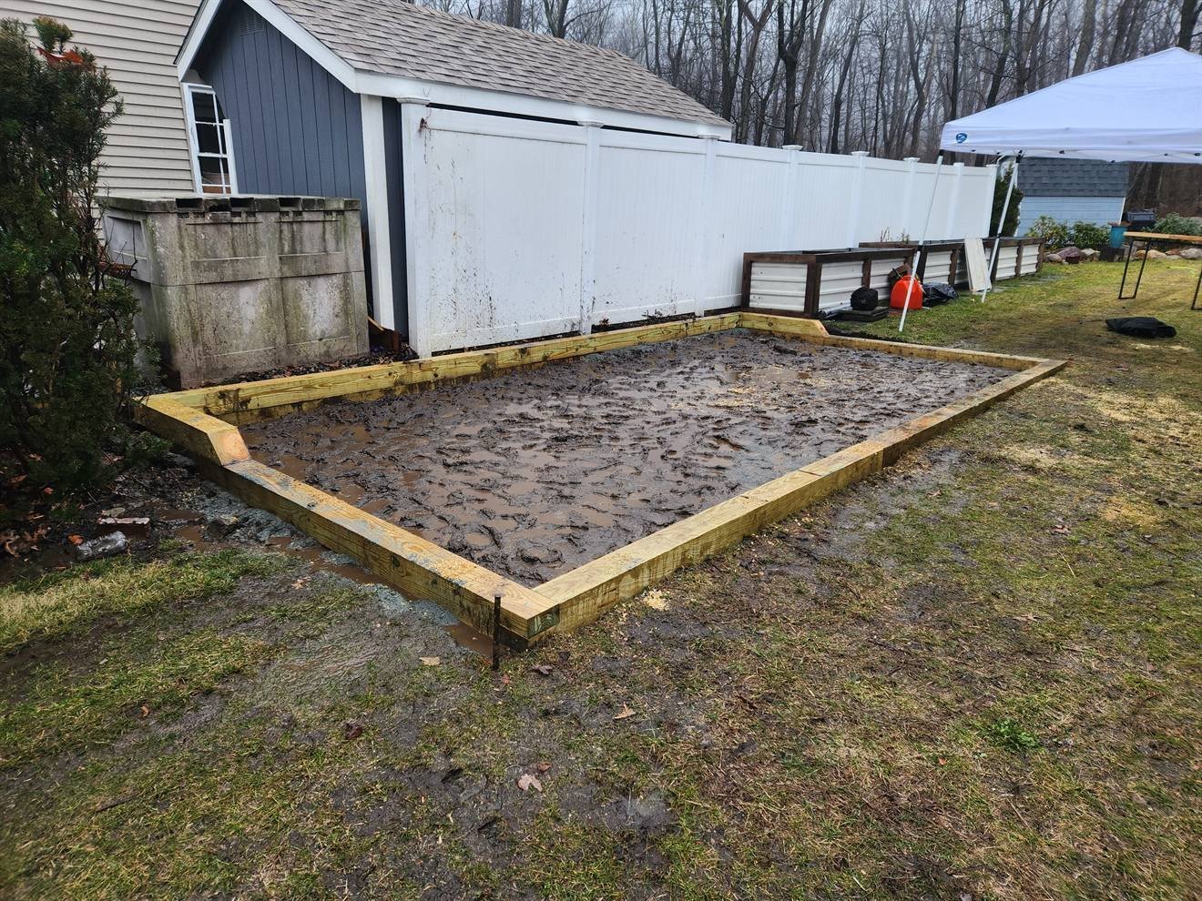 Backyard patio area framed during preparation
