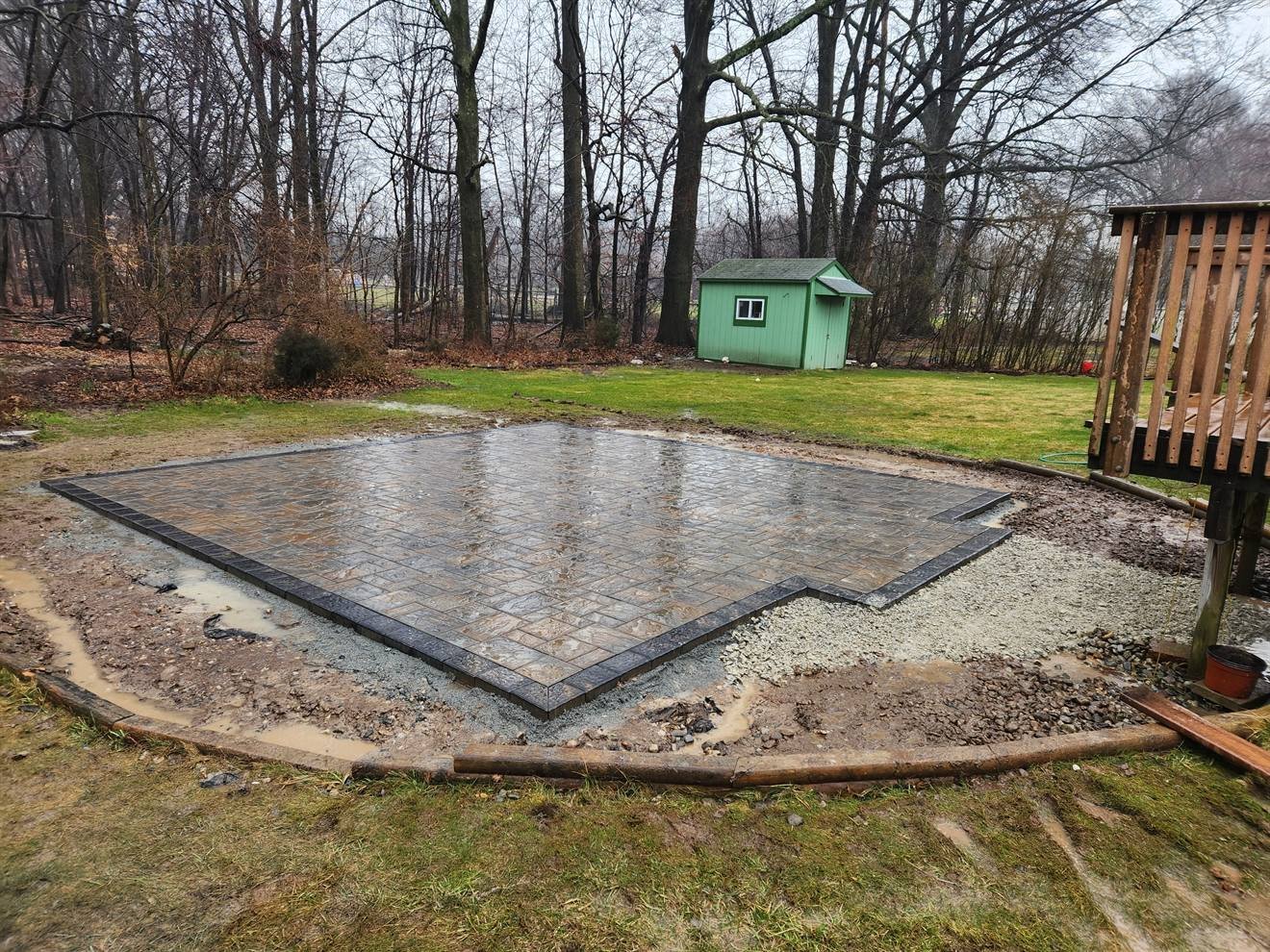 Paver patio installation with contrasting perimeter course