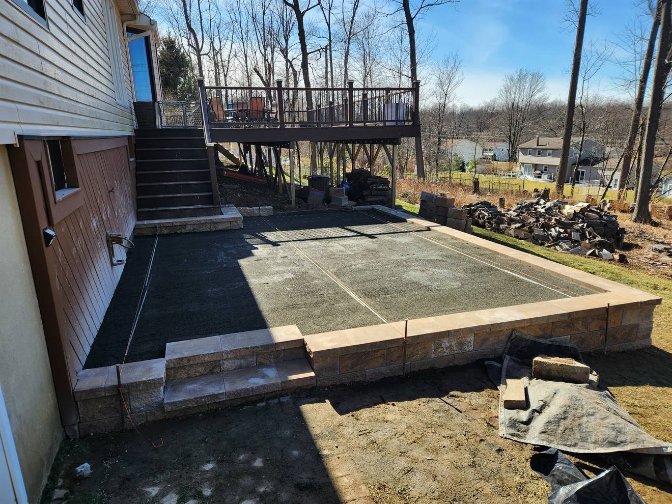 Retaining edge and patio base during construction