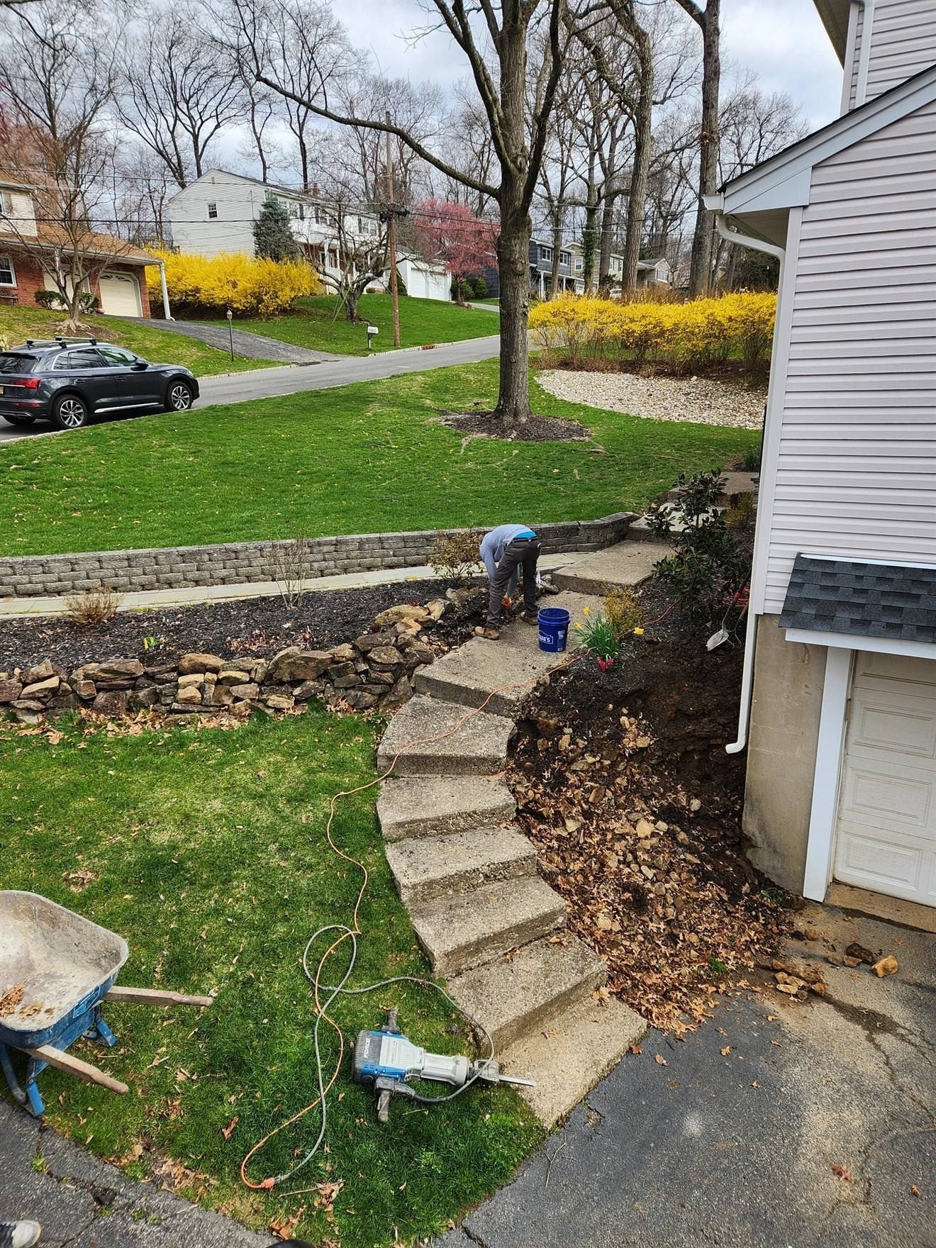 Sloped side yard before retaining-wall and step work