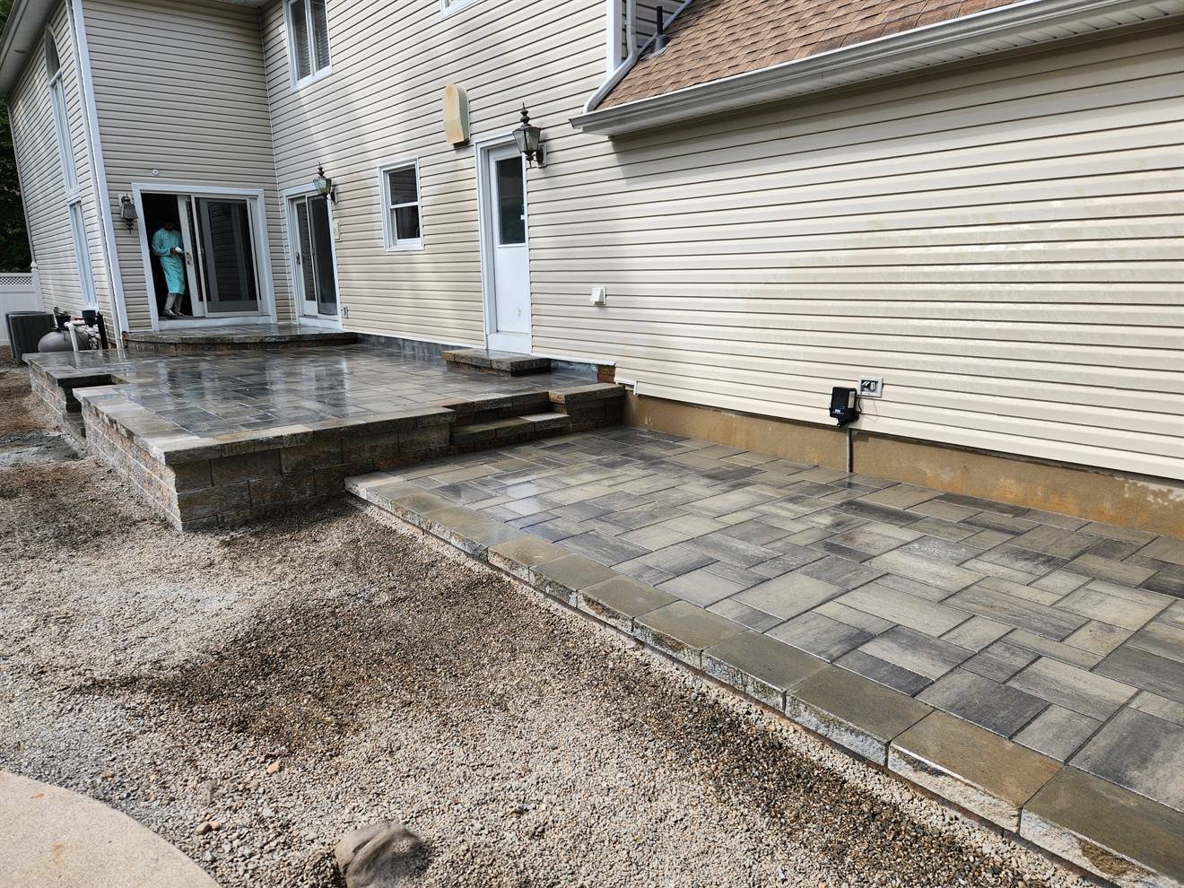 Multi-level paver patio with steps and contrasting border